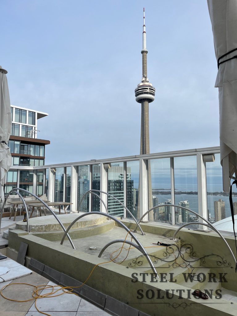 Stainless steel pool railings installed at KOST rooftop restaurant in Toronto by Steel Work Solutions
