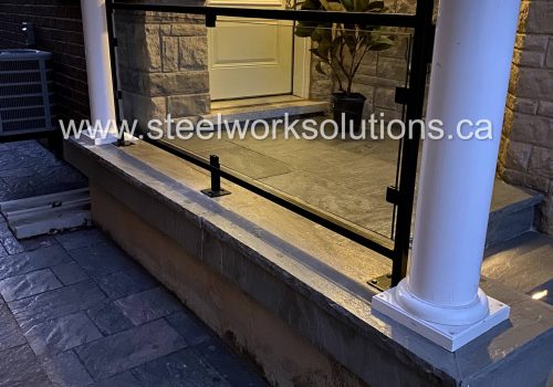 Custom Glass & Wrought Iron Porch Railing designed, fabricated, and installed by Steel Work Solutions in Burlington, ON.