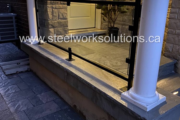 Custom Glass & Wrought Iron Porch Railing designed, fabricated, and installed by Steel Work Solutions in Burlington, ON.